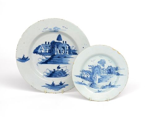 A Bristol delftware charger and a plate  c.1760, painted in blue with variations of figures fishing and in small boats before