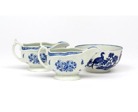 A pair of Worcester blue and white sauceboats  c.1775, moulded and painted with the Strap Flute Floral Sauceboat pattern, wit