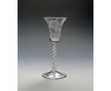 A good wine glass  c.1760, the bell bowl finely engraved with a botanical flower spray, raised on a mixed twist stem of a sin