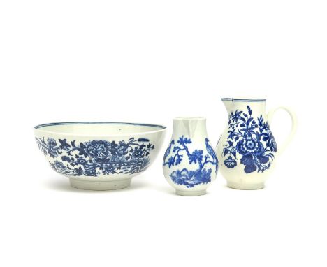 Two Worcester blue and white milk jugs  c.1765-75, one printed with the Birds in Branches pattern, the other with the Three F