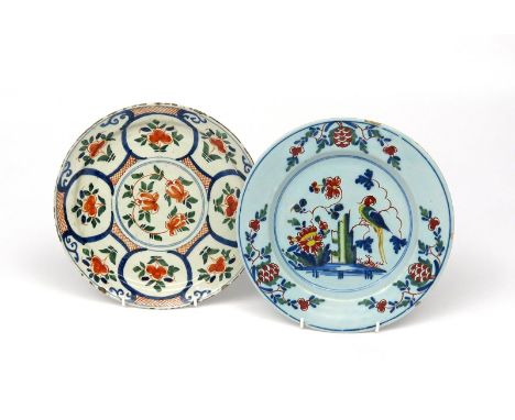 Two London delftware plates  c.1720-40, one painted in red, green and blue with stylized flower sprigs in panels on a red hat