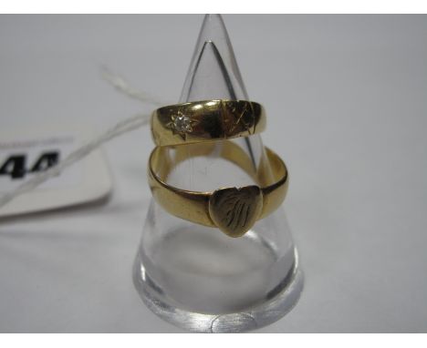 A 22ct Gold Band, with applied heart, initialled; together with a single stone ring, star set. (2)