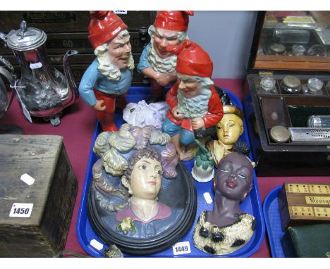 A Circa 1910 Painted Oval Relief Portrait Wall Plaque, three hollow cast garden gnomes and other wall masks:- One Tray
