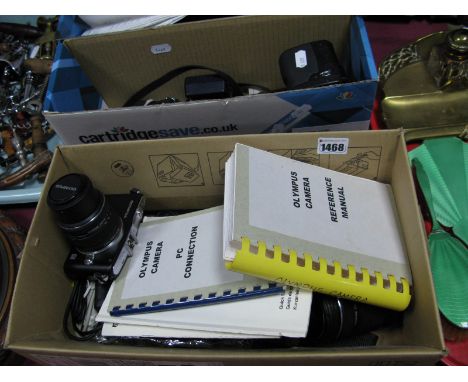 Two Olympus Digital Cameras, including a C5050, An Olympus 40-150mm digital lens, a Panasonic DMC-FZ30 digital camera, Panaso