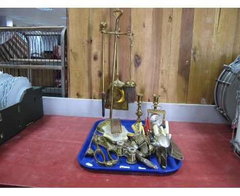 An Early XX Century Brass Fireside Companion, Swiza table clock, candlesticks, loose cutlery, dressing table items, brass and