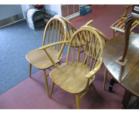 A Pair of Ercol Light Ash Armchairs, with spindle backs; a pair of matching single chairs. (4)
