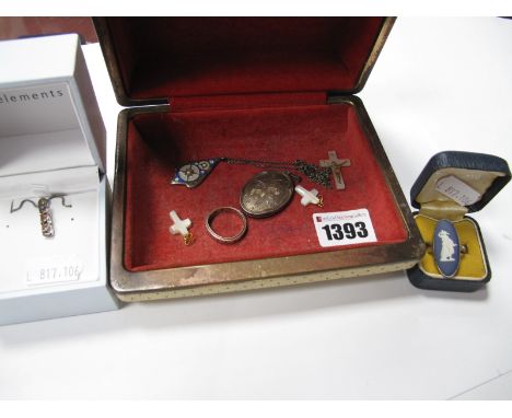 A Hallmarked Silver Oval Locket Pendant; together with a decorative pendant, eternity band, cross, Wedgwood Jasperware ring, 