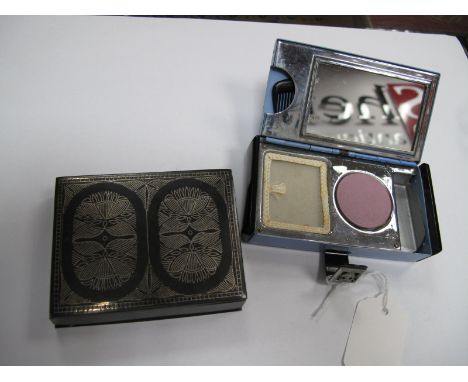 An Art Deco Compact, with fitted interior for lipstick, powder, blush and comb; together with a Niello style rectangular ciga