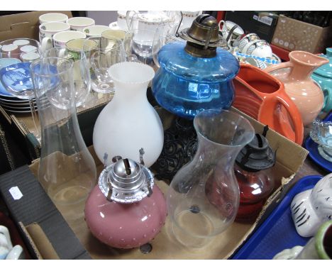 XIX Century Oil Lamp, with a blue glass well on a cast iron base, other oil lamps, and glass funnels:- One Box