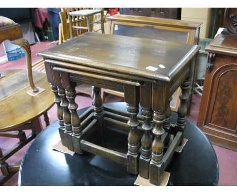 A XX Century Joined Oak Nest of Three Tables, rectangular tops, moulded edge on block and ring  turned stretchered legs.