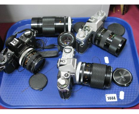 Camera Interest - A Canon FTb QL with a 35/70mm 200m lens, a Canon AT-1 with a 135mm lens, Canon AE-1 with 50mm 1:1.8 lens, a