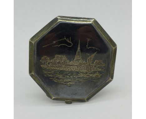 A silver compact, marked sterling Siam