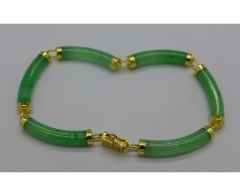 A silver gilt and jade bracelet