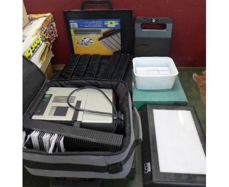 A Leica Pradovit P150 slide projector, a large collection of slides and a viewer