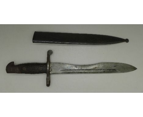 A bayonet with scabbard, the blade marked Toledo