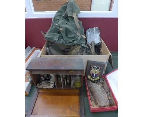 Military related items including uniforms, helmet, leathers, a flask, shrapnel dug up near Basselle, Somme, a sheepskin gilet