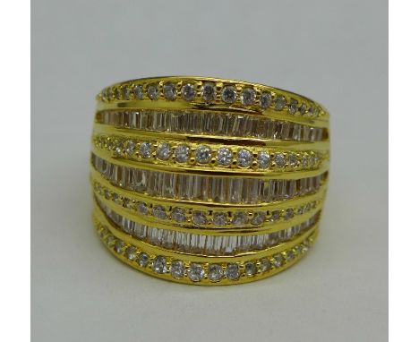 A silver gilt and cubic zirconia ring, P, 17mm wide
