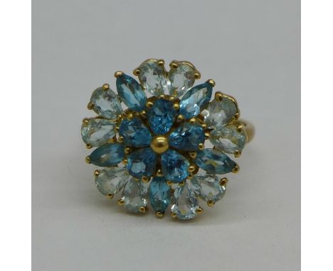 A 9ct gold and blue stone cluster ring, 3.9g