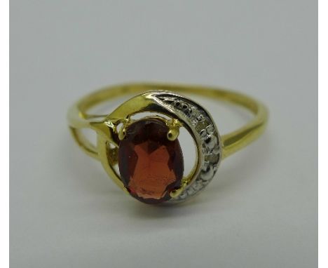 A 9ct gold, garnet and diamond ring, 1.2g, O