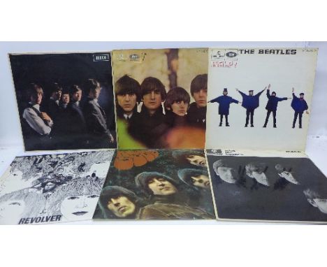 Six The Beatles LPs and a Rolling Stones LP