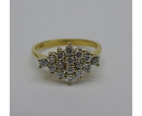 An 18ct gold sixteen stone diamond cluster ring, 0.5 carat weight, London 1988, 3.3g, size N