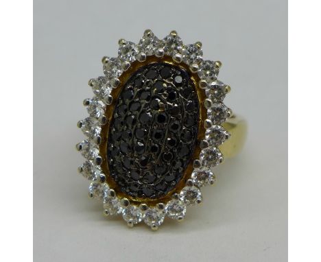 A large 9ct gold, black and white stone cluster ring, 10.1g, 23mm x 17mm