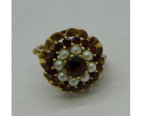 A 9ct gold, garnet and pearl ring, 4.2g, L