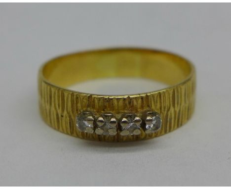 An 18ct gold and diamond ring, 3.6g, R