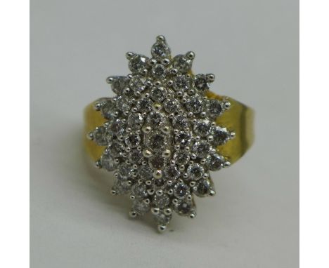 A 9ct gold and diamond cluster ring, 4.1g, K