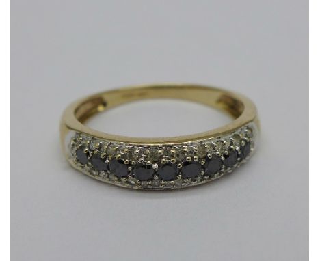 A 9ct gold, sapphire and diamond ring, with nine sapphires and twenty two diamonds, 2.1g, P