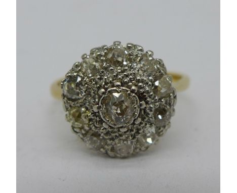 A 1930's 18ct gold platinum set eleven stone old mine cut diamond ring, 3.7g, 1.25 carat weight, size N½