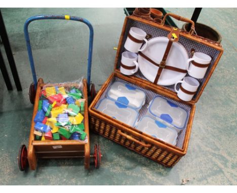 Vintage Triang baby walker with wooden block toys and a picnic hamper