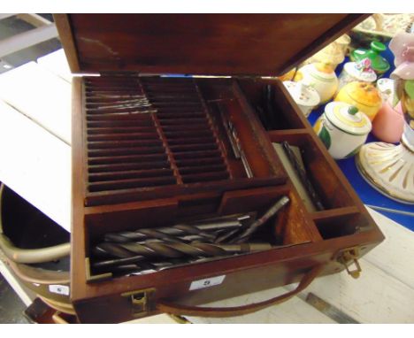 A toolbox with contents, drill parts etc.
