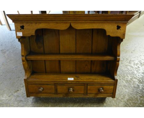 A small oak spice rack