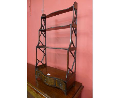 An Edward VII Chippendale Revival mahogany three tier wall shelf