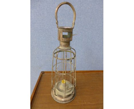 A storm lamp garden lantern