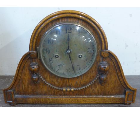 An oak mantel clock