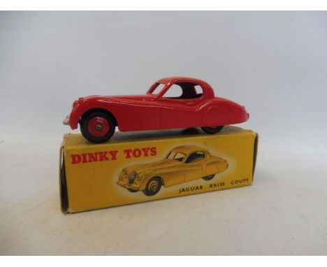 A boxed Dinky Toys Jaguar XK120, red, no. 157.