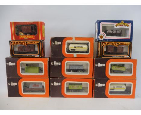 A selection of boxed Lima rolling stock.