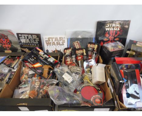 A large quantity in three boxes of Star Wars, mainly Episode One, to include light saber, a boxed naboo pistol.