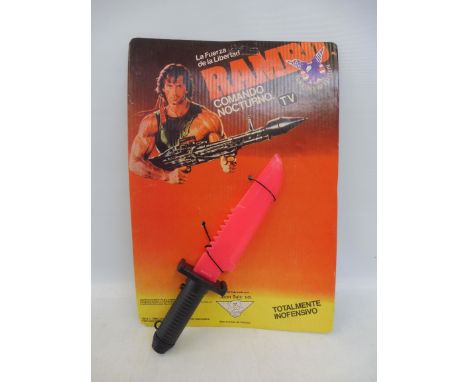 An unpunched carded out-of-licence Rambo, light up knife, dated 1988, Argentinian issue.