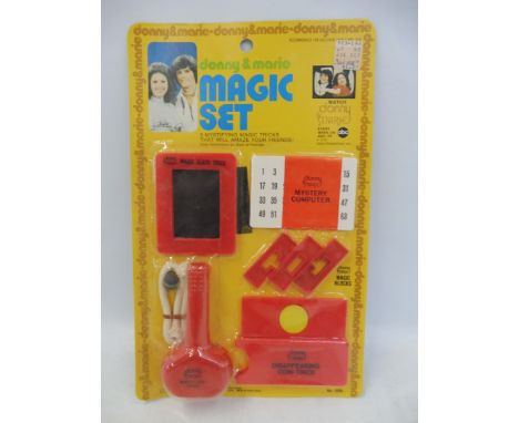 An unusual Donny and Marie carded magic set, Made in Hong Kong.