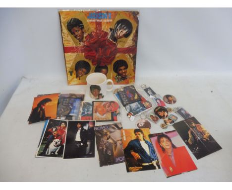 A selection of original Michael Jackson collectables, to include fan club ephemera, badges, patches etc.