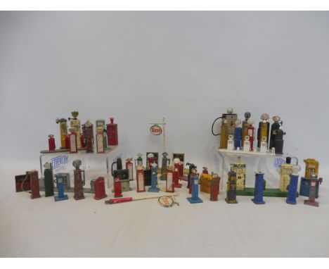 A good selection of miniature die-cast model petrol pumps, Dinky and Impy included.