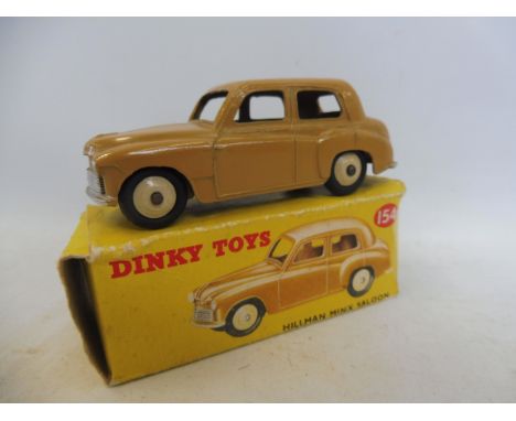 A boxed Dinky Toys Hillman Minx Saloon, no. 154, box has some tape and is detached.