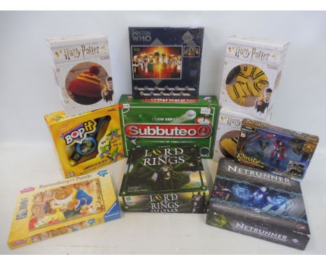 A quantity of Harry Potter, Lord of the Rings and other boxed games.