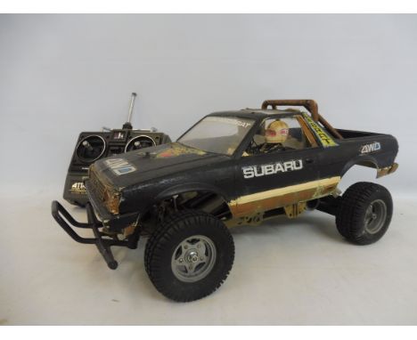 A Tamiya Subaru Brat 1:10 scale remote controlled car, 4WD, circa 1983.