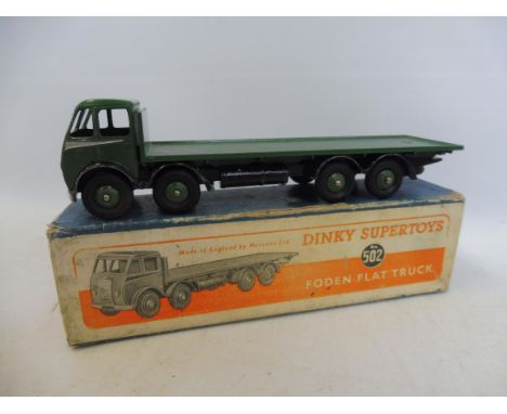 A boxed Dinky Toys Foden flat bed lorry, first cab version, green, no. 502.