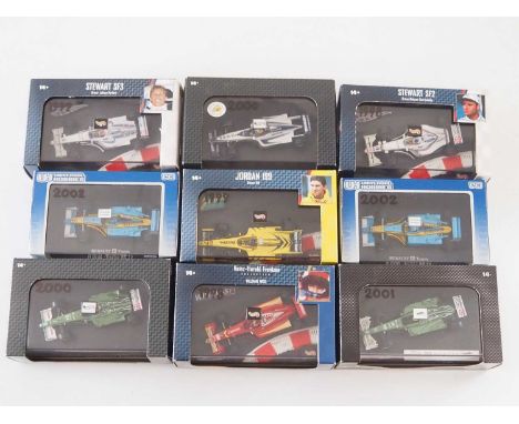 A group of 1:43 scale Formula 1 race cars by HOTWHEELS and UNIVERSAL HOBBIES, comprising of 1990s and early 2000s Formula 1 r