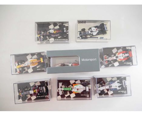 A group of 1:43 scale Formula 1 race cars by MINICHAMPS (one example in Mercedes Benz branded packaging), comprising of F1 ca